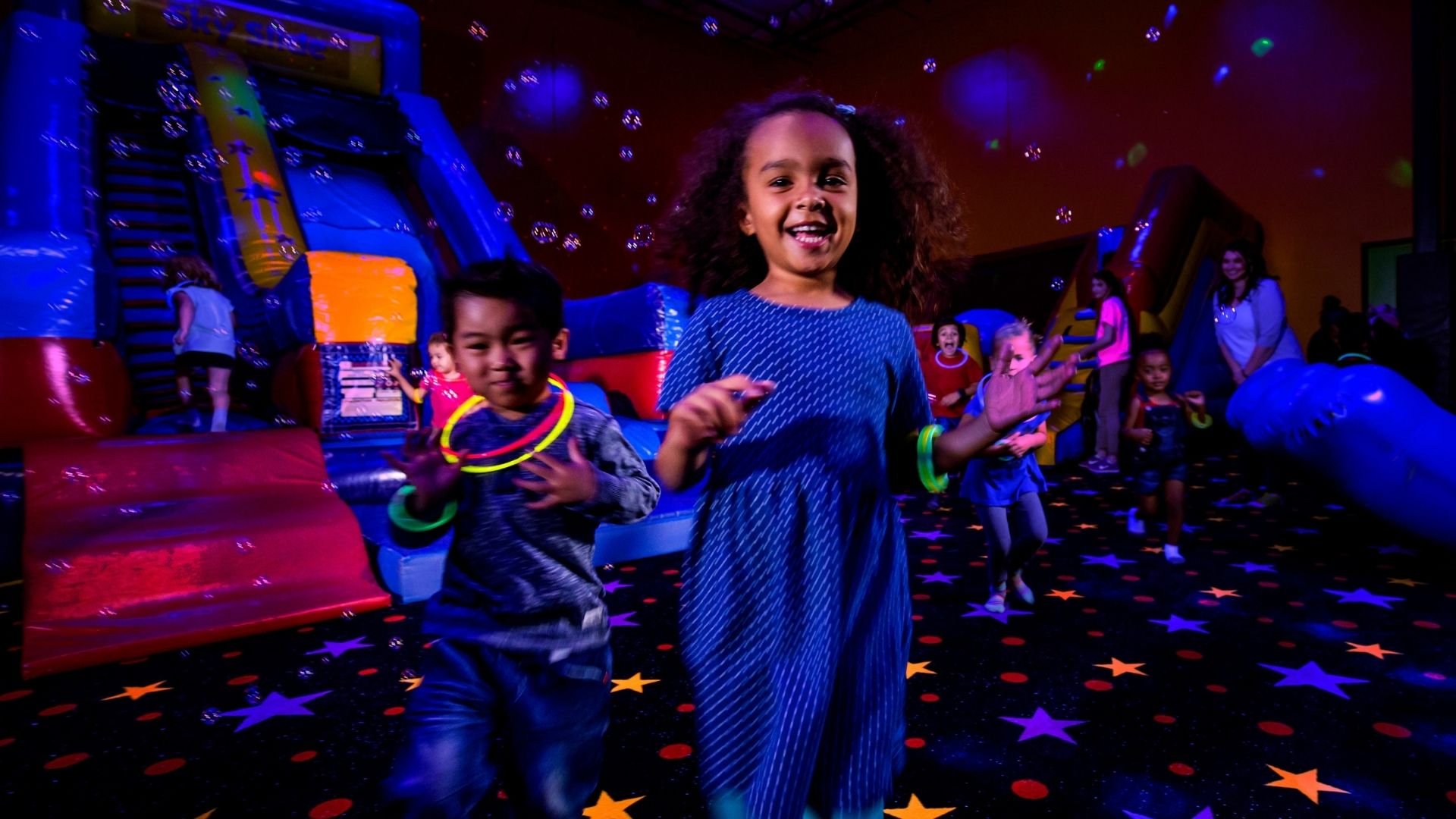 Children celebrating birthday party at AI Experience Park with decorations and activities